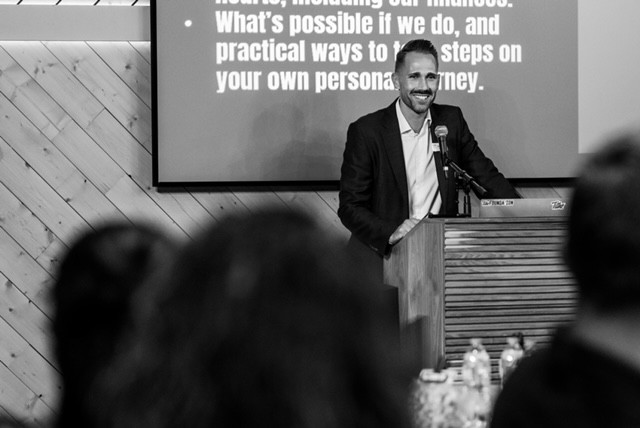 Mark Greaves presenting from the podium